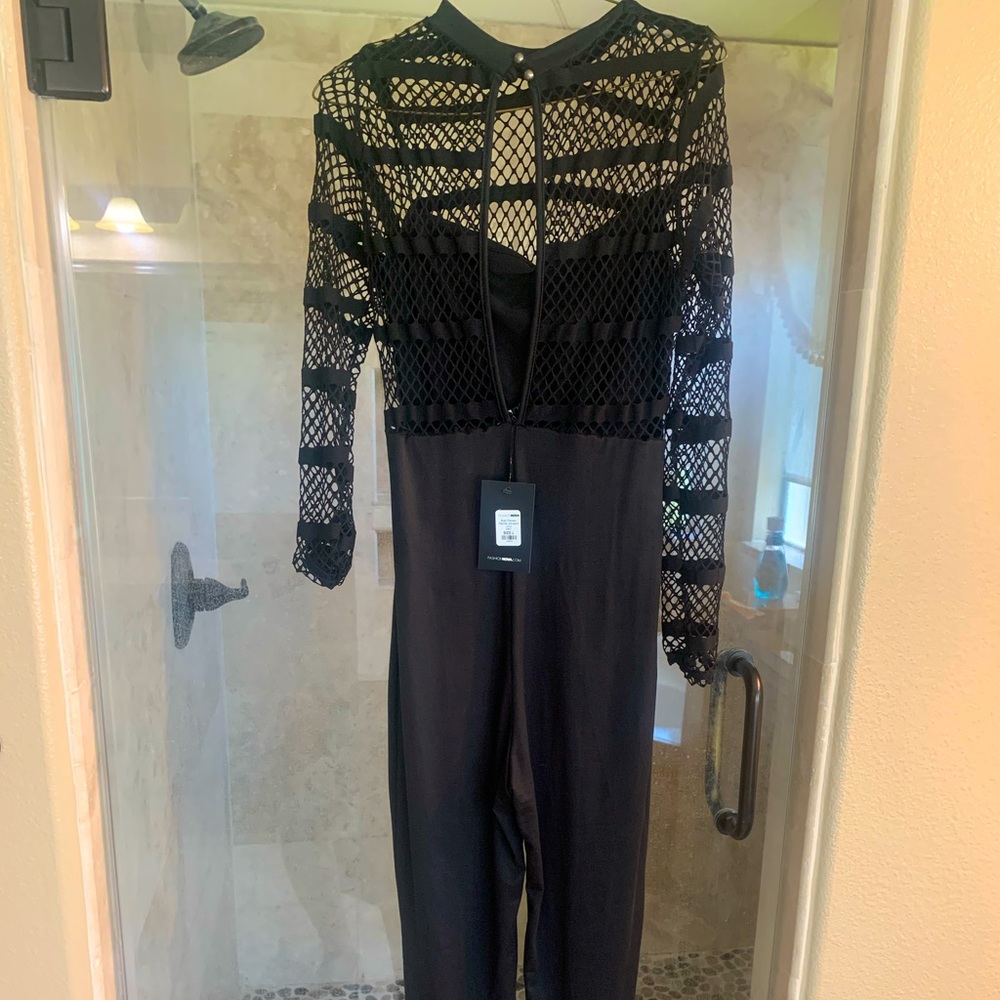 Black stretch jumpsuit with fish net cage